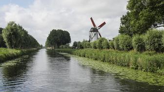 Canal and windmill outside of Bruges, Belgium