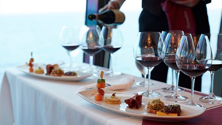 Enjoy a classic wine pairing tasting onboard an Oceania voyage as a Club Member.
