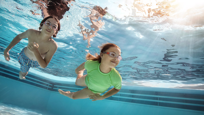 Enjoy a family swim onboard the Norwegian Encore.