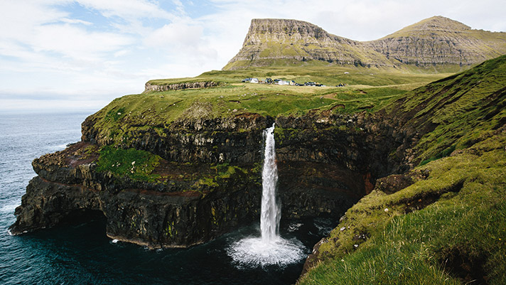Cascading waterfalls in Gasaldur of the Faroe Islands