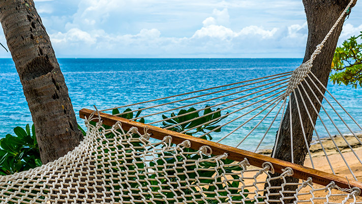 Sit back and relax on a hammock in Fiji.