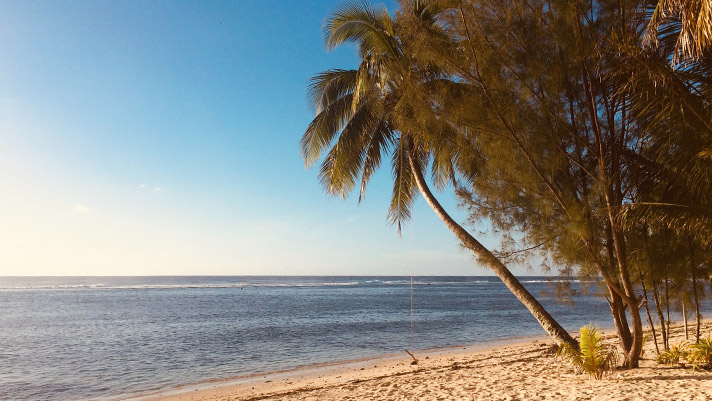 Unwind at a stunning beach in the Cook Islands.