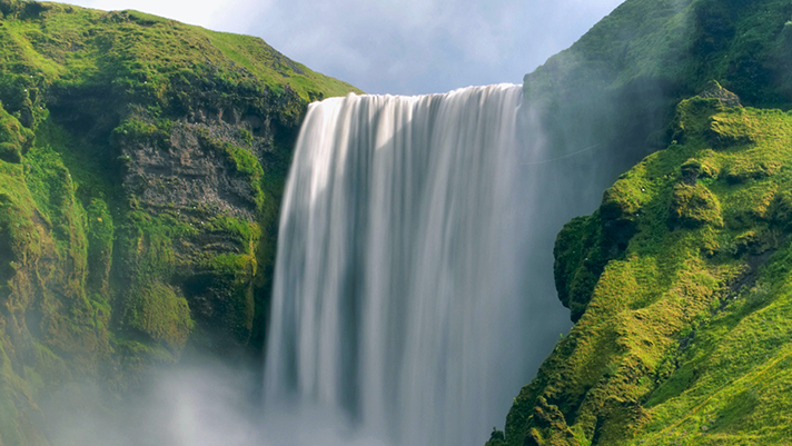 Awe at the magnificent Skogafoss Waterfall.