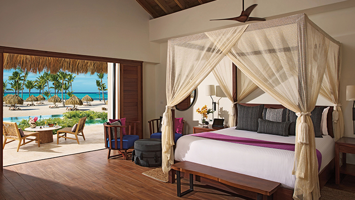 Unwind with luxurious amenities in a Secrets Cap Cana Suite.