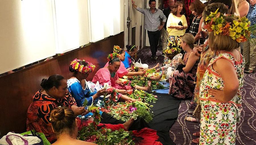 Polynesian Night onboard MS Paul Gauguin. Locals from Moorea come to teach lei making and head dress making.