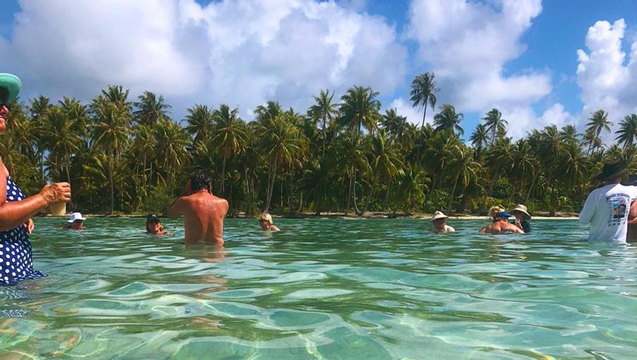 Relaxing in the shallow waters of Motu Mahana, Paul Gauguin's private island.