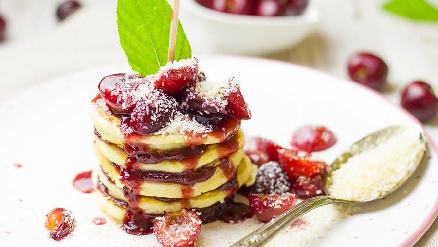 Pancakes with fresh berries on top.