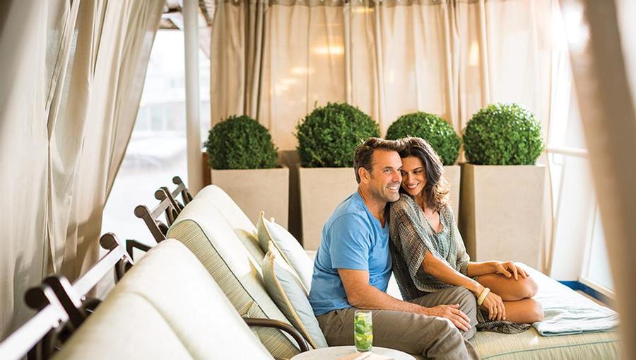 Couple enjoying cabana life.