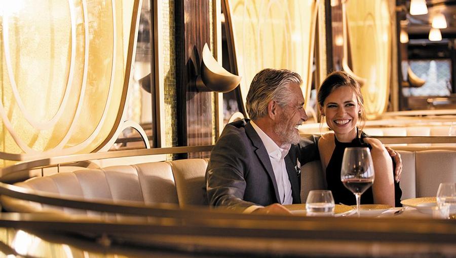 Couple enjoying drinks in a lounge.