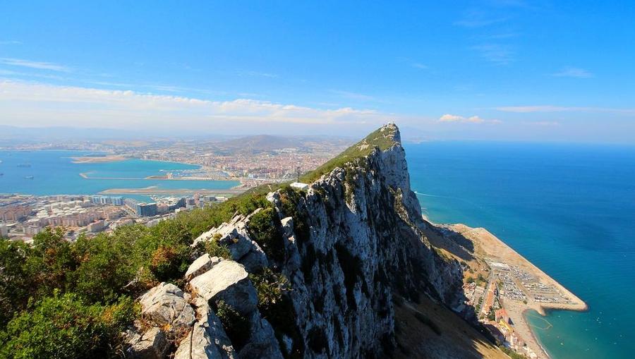 An aerial view of a mountain overlooking the ocean in Gibraltar.