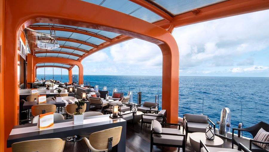 A view of the Magic Carpet with an ocean view onboard Celebrity Edge.