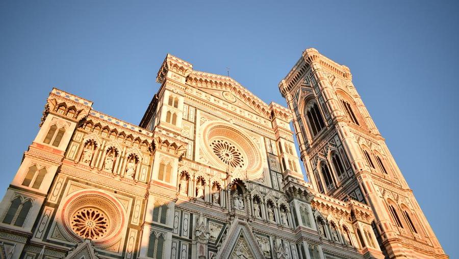 Il Duomo tower with sun rising in Florence.