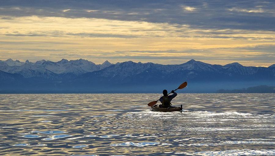 Kayaking on the gorgeous Starnberg See freshwater lake in Munich.