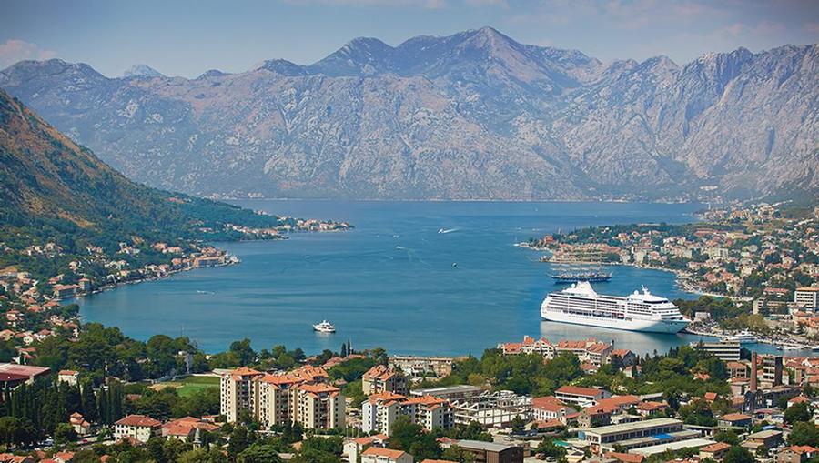 Regent Cruises ship docked in a Europe harbor