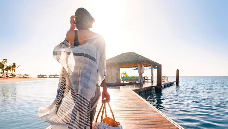 Woman walking towards Floating Cabana - Perfect Day at CocoCay